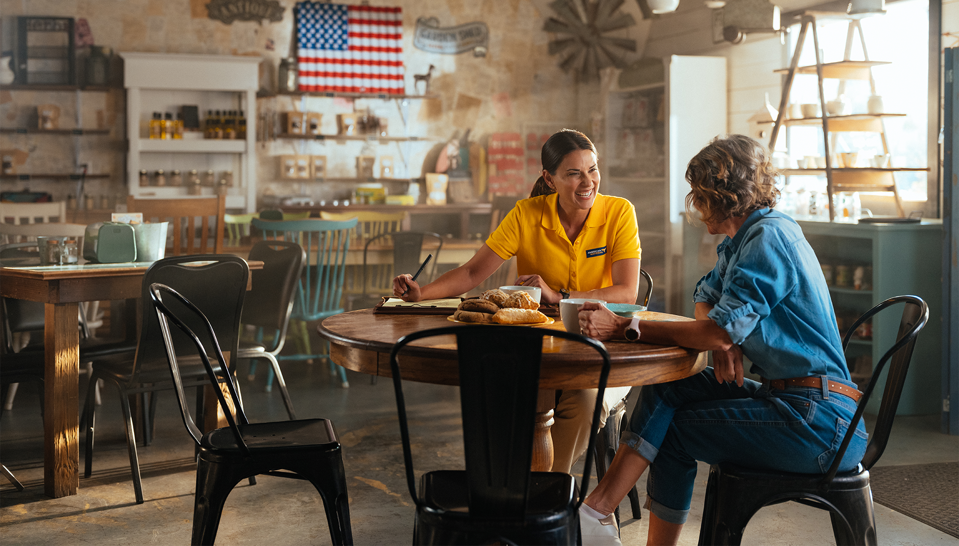 two women enjoying coffee at a table