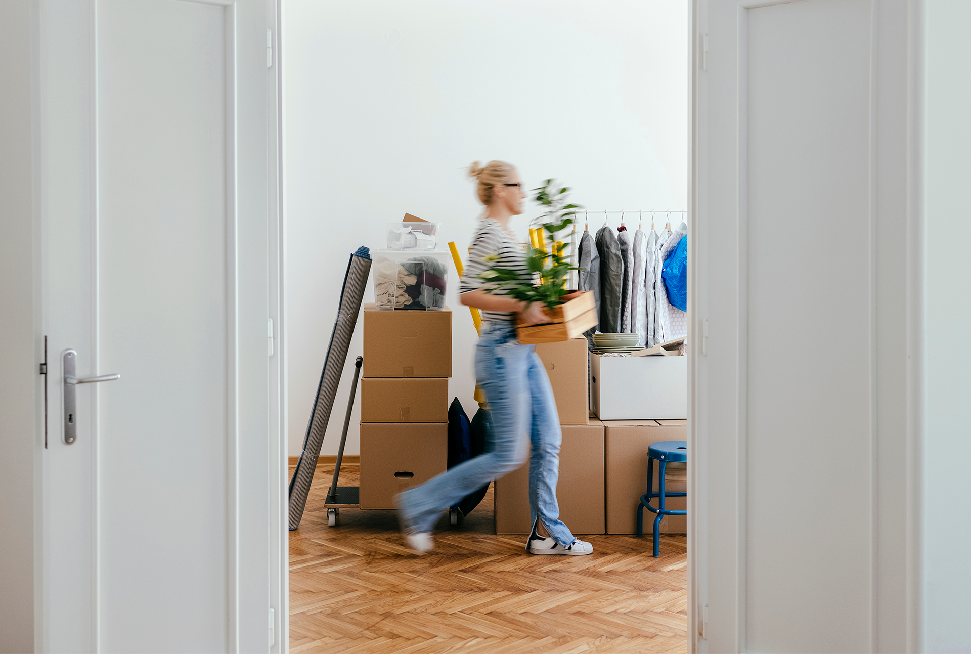 woman moving quickly with moving boxes