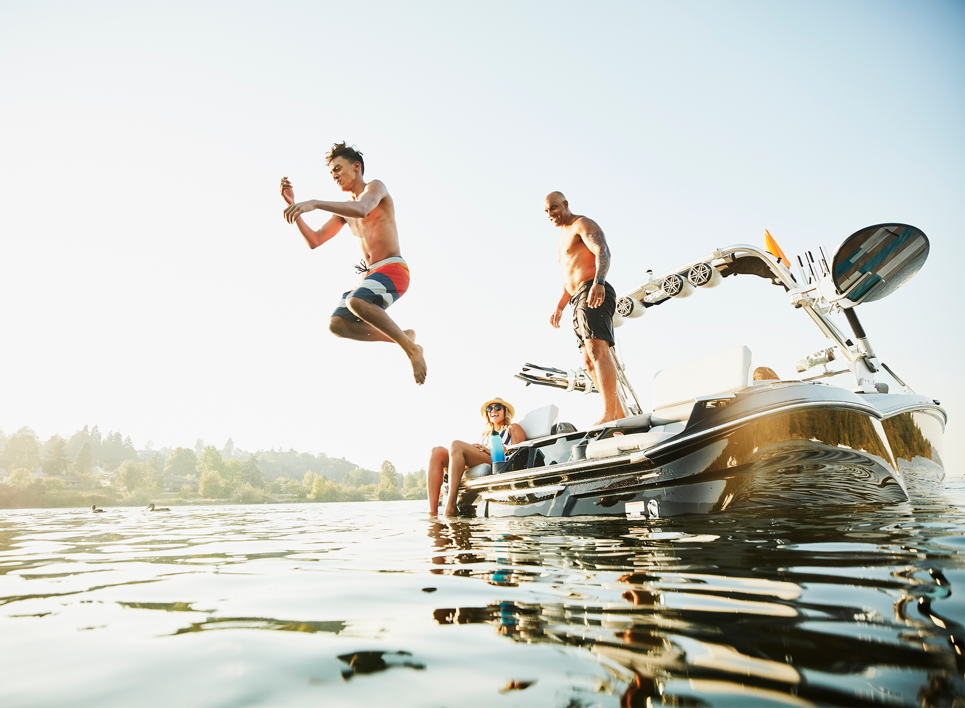 family on a boat on a lake