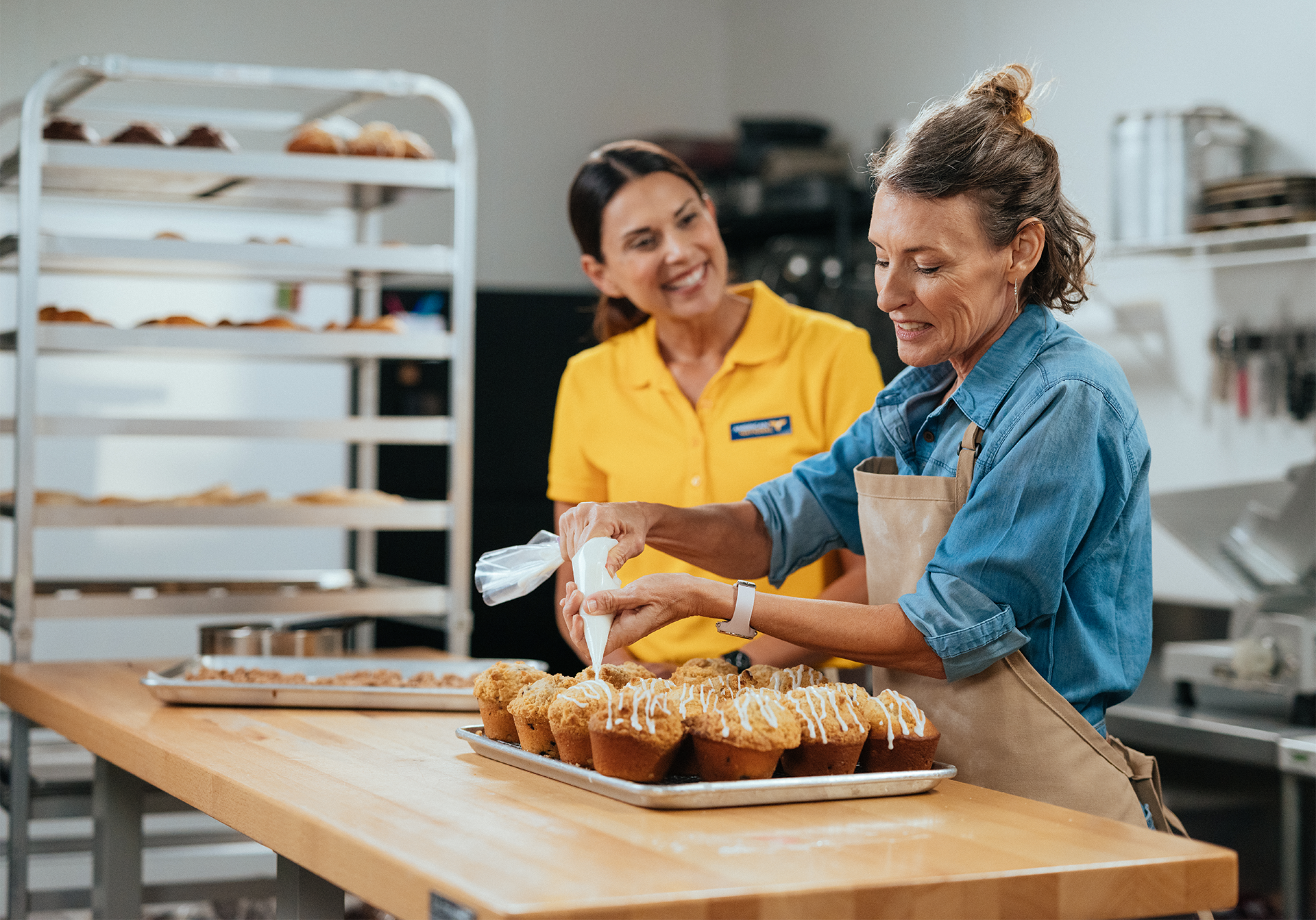 woman decorating cupcakes